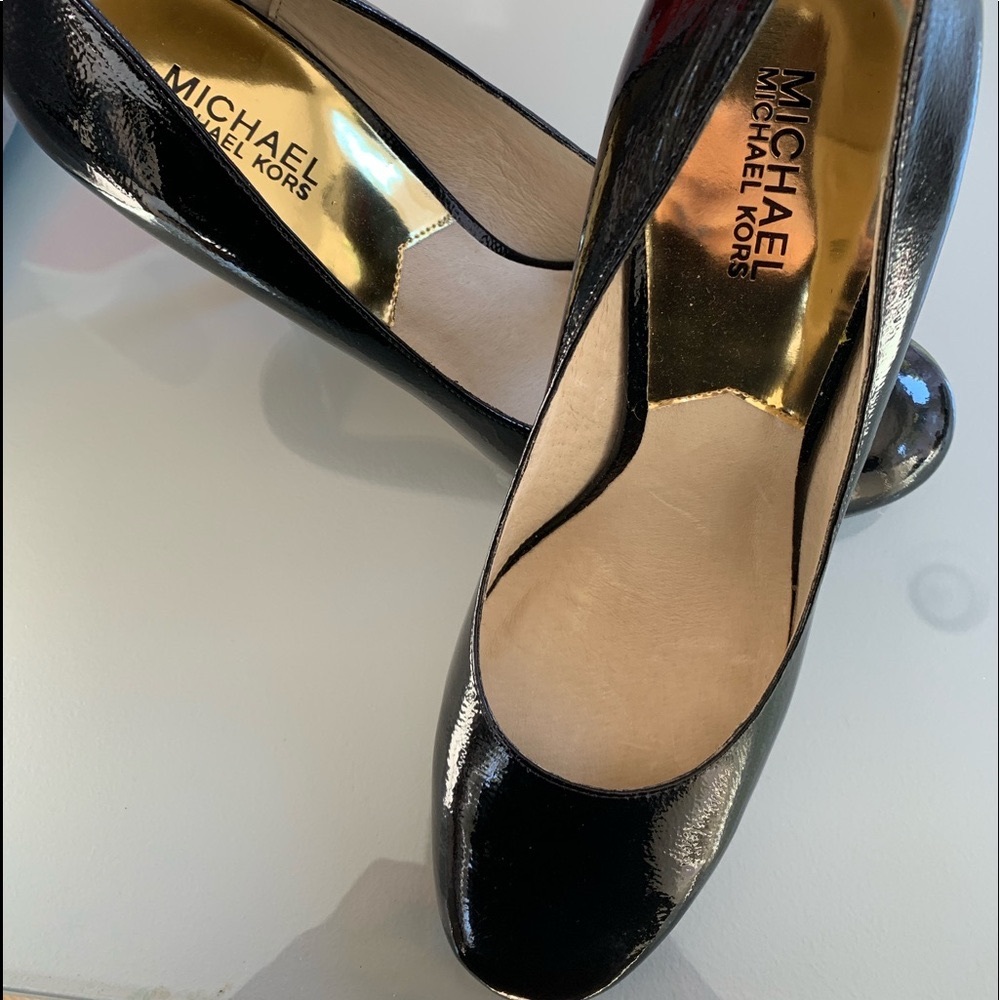 Black patent Michael Kors pumps.  Never worn